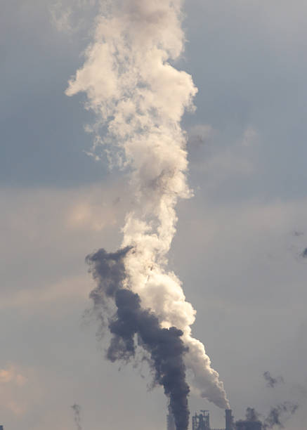 istock A large cloud of smoke is rising from a factory 2247243397