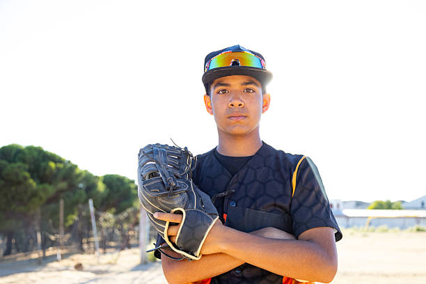 istock Young male baseball player posing confidently on field 2247243823