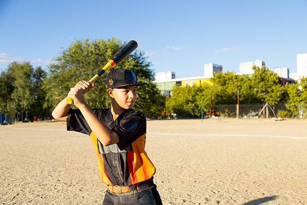 istock Young baseball player concentrating during a youth game 2247243858