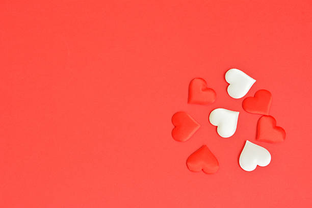 istock Red and White Hearts on a Vibrant Red Background copy space 2247246153