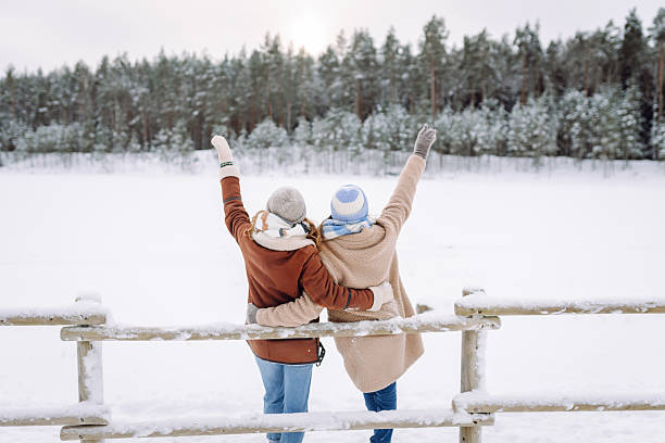 istock Two young women pose outdoors in a snowy forest. 2247249973