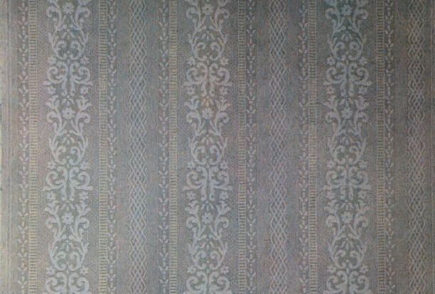 istock Old wallpaper on the wall. Old wallpaper for texture or background. 2247250020