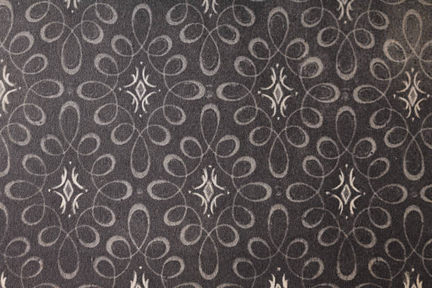 Old wallpaper on the wall. Old wallpaper for texture or background.