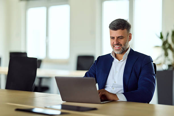 istock Confident Professional Balances Laptop And Focus In Bright Modern Office Setting 2247250153