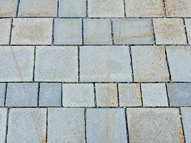 istock Granite pavement in gray tones with irregular pattern and natural patina 2247250263
