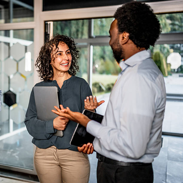 istock Diverse business colleagues having a conversation in office 2247250303