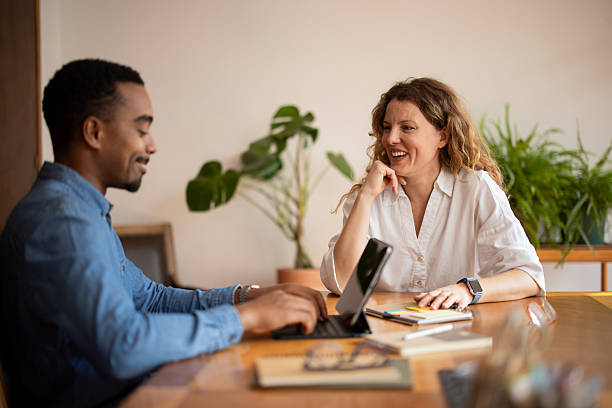istock Colleagues collaborating and discussing business ideas in office 2247253233