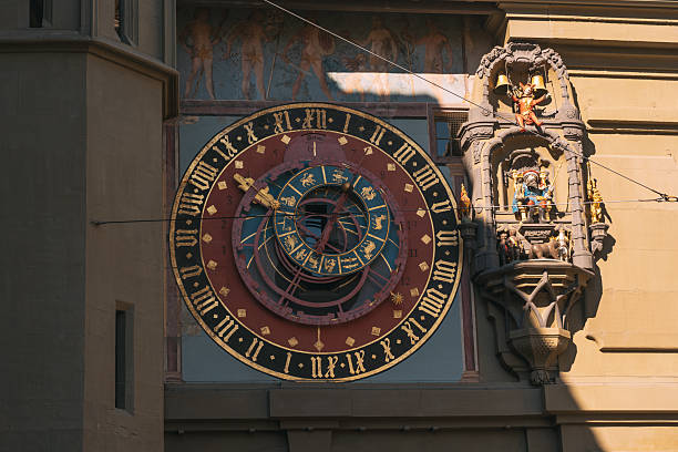Ornate zytglogge astronomical clock showing time and zodiac symbols on a historic tower