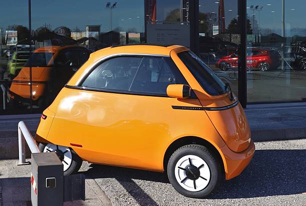 Avellaneda, Argentina - May 18, 2024: Old yellow economy micro car BMW Isetta 300, 1955 - 1962 at a classic car show in a garage