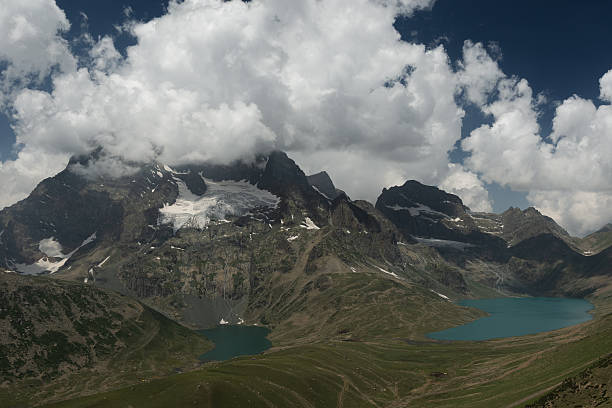 istock Rocky Mountain Range with Remaining Snow Overlooking a Blue Alpine Lake 2247254675