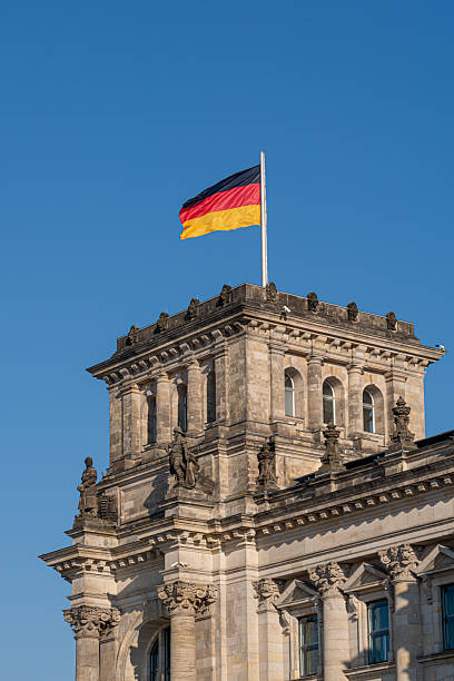 istock Tower of the Reichstag with a German flag 2247256534