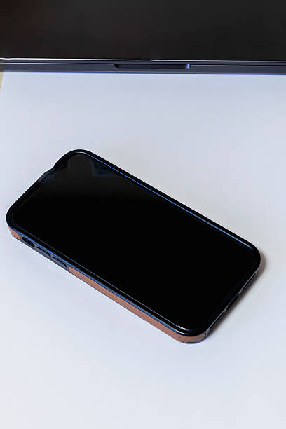 istock Laptop and mobile phone on desk 2247256926
