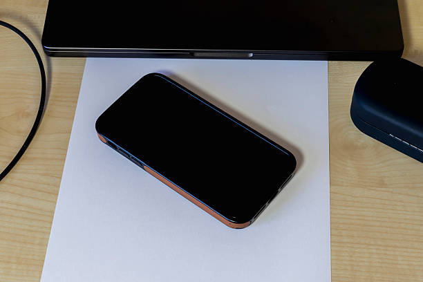 istock Laptop and mobile phone on desk 2247256963