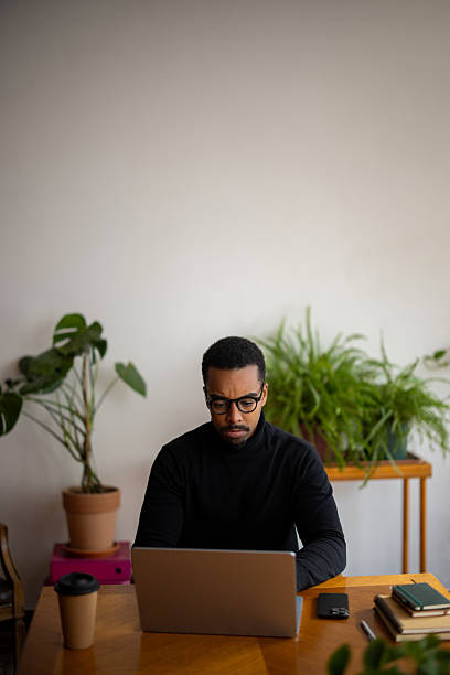 istock Man working on laptop at modern home office 2247258212