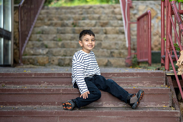 Smiling young boy outdoors