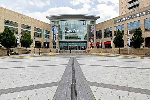 Liverpool, United Kingdom - June 19, 2011: Shoppers in the South John Street area of Liverpool ONE shopping centre. Liverpool ONE is the largest open air shopping centre in the United Kingdom, the mixed office, retail and residential development has helped revive the fortunes of Liverpool's city centre.