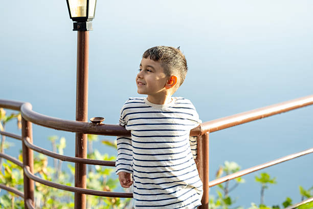Smiling young boy outdoors