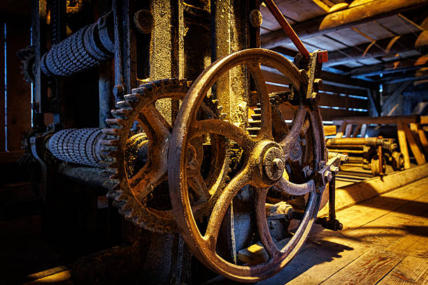 istock Antique industrial gears inside rustic wooden workshop 2247264783