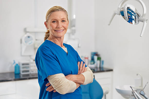 istock Confident female dentist looking at camera in clinic 2247268087
