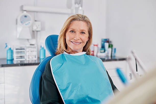 istock Happy mature woman smiling  at dentist 2247268345