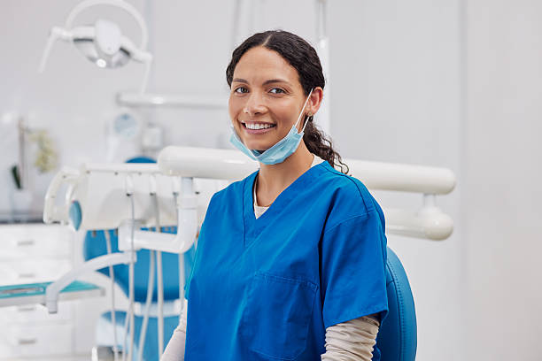 istock Smiling young hispanic dentist in clinic 2247268504