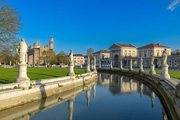 istock Prato della Valle is a large square in Padua, Italy, with a central elliptical island, surrounded by a canal and statues. 2247268994
