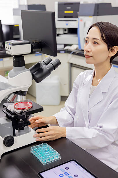 istock Asian man in a white coat working in a laboratory 2247270400