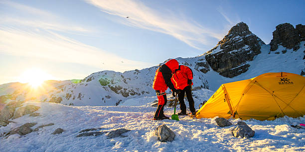 istock Expert Mountaineer Setting up Tent at High Mountain Base Camp Amidst Snowy Peaks 2247270543
