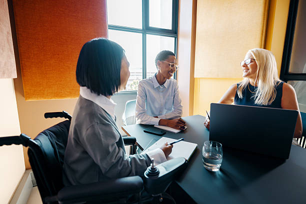 istock Team members engaged in a meeting in a modern office workspace 2247273334