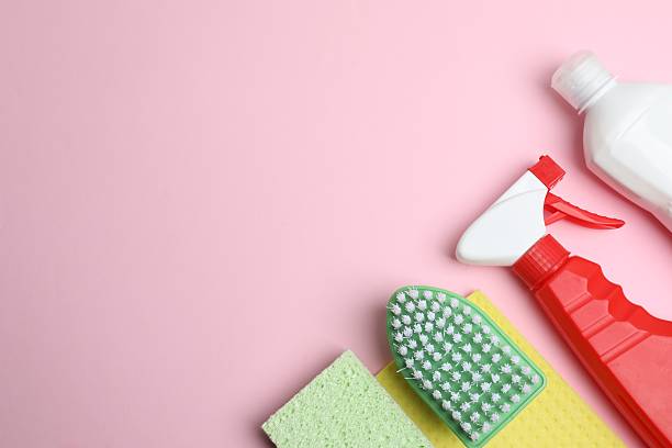 istock Housekeeping concept. Cleaning supplies  on a pink background. 2247273387