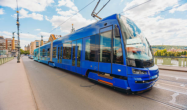istock Modern blue tram on Prague city bridge. 2247274793