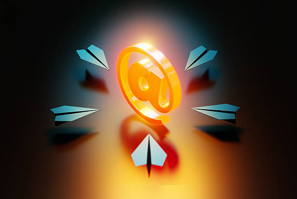 Blue paper planes flying toward an orange colored glowing at symbol on black background.