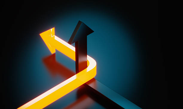 istock Yellow And Black Colored Arrows On Black Background 2247276322