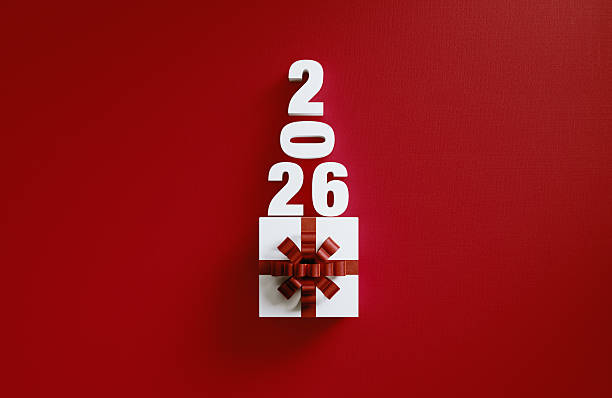 istock Giftbox And 2026 Forming A Christmas Tree On Red Background 2247276390