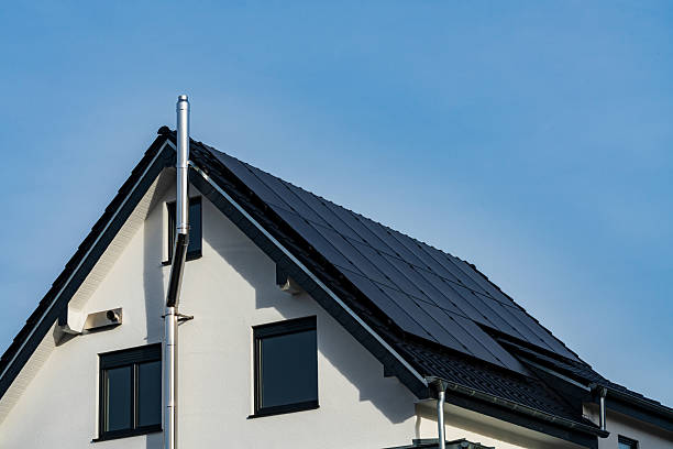 istock Solar panels installed on a modern house roof during clear weather 2247276423