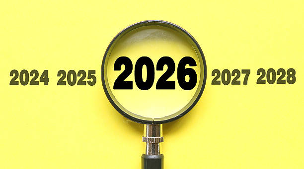 istock New Year 2026 is enlarged using a magnifying glass. 2026 highlighted through a magnifying glass, with 2025 and 2027 displayed on each side 2247276745