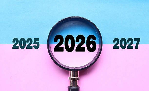 istock New Year 2026 is enlarged using a magnifying glass. 2026 highlighted through a magnifying glass, with 2025 and 2027 displayed on each side 2247276760
