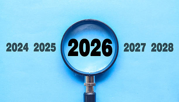 istock New Year 2026 is enlarged using a magnifying glass. 2026 highlighted through a magnifying glass, with 2025 and 2027 displayed on each side 2247276774