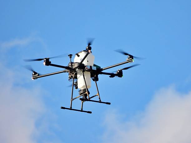 istock Drone drops larvicide pellets into mosquito breeding grounds to kill mosquito larvae before they become biting adults. 2247277837