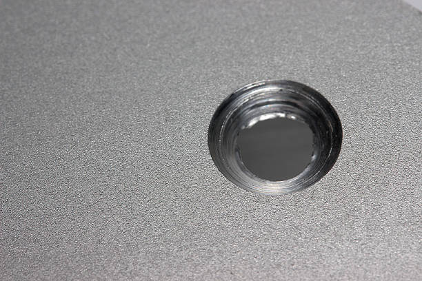 a countersunk milled hole in an aluminum facade profile in close-up. a macro photo of the production process. an illustration. a space for text