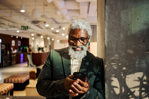 istock Mature adult professional checking smartphone in modern office 2247282306