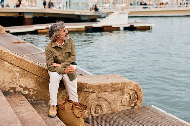 Thessaloniki, Greece - March 21, 2025. People relaxing on the Nea Paralia - Seaside Promenade in Thessaloniki, Greece.