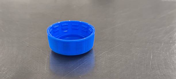 istock A blue soda bottle cap sits on a stainless steel table. 2247284142