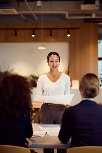 istock Asian Woman Presents Project Plan During Professional Meeting In Modern Office 2247285054
