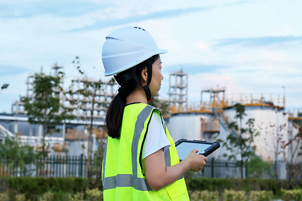 istock A young Asian female engineer in a chemical plant (back view) 2247285139