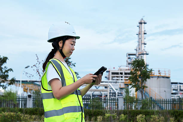 istock Young Asian female engineers work in chemical plant 2247285228