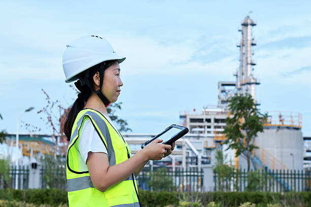 istock Young Asian female engineers work in chemical plant 2247285284