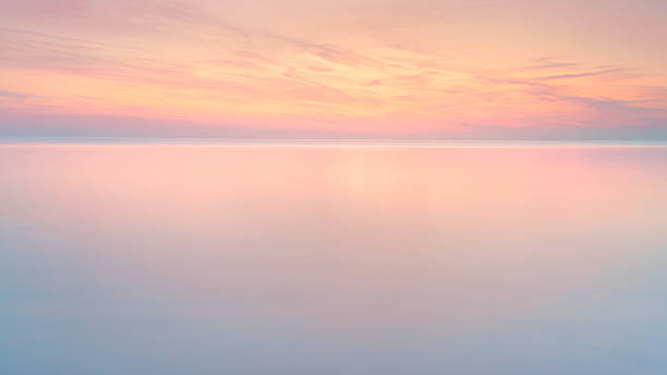 istock Ethereal Horizon at Twilight Over Calm Waters 2247286169