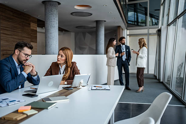 istock Business people collaborating in modern office discussing strategy 2247288815