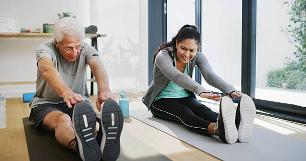 istock Stretching, physiotherapist and workout with old man, clinic and exercise to improve posture or heal. Fitness, wellness and elderly patient with woman, retirement and training for rehabilitation 2247289146